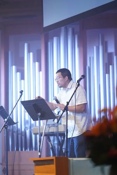 Speaker sharing a message from the stage